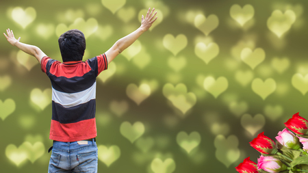 Valentine asian man hand up on bokeh cute little hearts love backgroundの写真素材