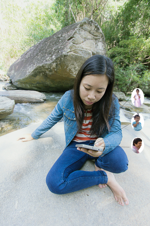 asian woman with social network of friends and clientsの写真素材