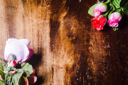 Plastic rose on  wooden background valentineの写真素材