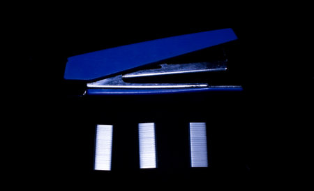 Blue sewing mags Isolated on black backgroundの写真素材