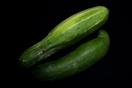 Fresh cucumber isolated on black backgroundの写真素材