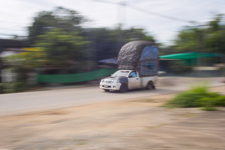 pick-up truck Speeding in road, panning camera, Thailand asiaの写真素材