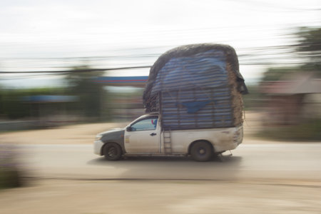 pick-up truck Speeding in road, panning camera, Thailand asiaの写真素材