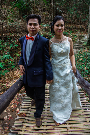 Portrait Wedding on bamboo bridge Asia Thai peopleの写真素材