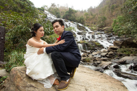 Portrait Wedding on huge waterfallの写真素材