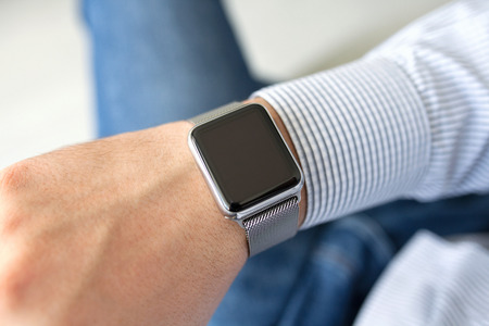 Man hand with smart watch in the homeの写真素材