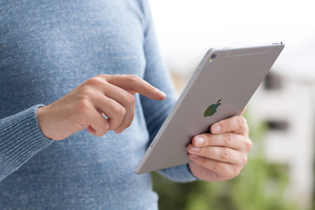 Alushta, Russia - June 5, 2016: Man holding in the hand a new iPad Pro Space Gray. iPad Pro was...