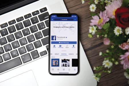 Koh Samui, Thailand - March 23, 2018: iPhone X with social networking service Facebook on the screen. iPhone 10 was created and developed by the Apple inc.のeditorial素材