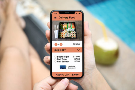 woman holding phone with app delivery sushi food on screen by the pool