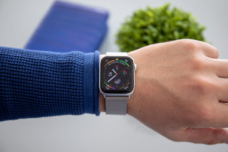Alushta, Russia - November 3, 2018: Man hand with Apple Watch Series 4 in the home. Apple Watch was created and developed by the Apple inc.のeditorial素材