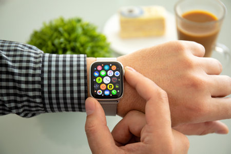 Alushta, Russia - November 6, 2018: Man hand with Apple Watch Series 4 in the home. Apple Watch was created and developed by the Apple inc.のeditorial素材