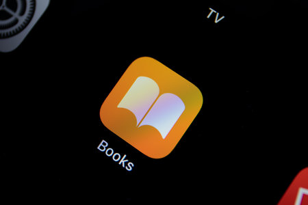 Anapa, Russia - March 31 2019: Photo Icon app on home screen with service Apple Books on the screen iPad Pro. iPad Pro was created and developed by the Apple inc.のeditorial素材