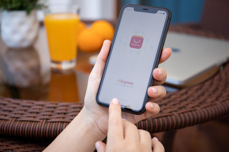 Alanya, Turkey - July 10, 2020: Woman hand holding iPhone 11 with phone call widget on the home screen. iPhone 11 was created and developed by the Apple inc.のeditorial素材