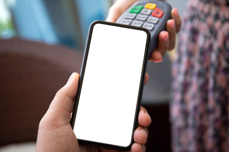 woman and man hands holding pay pass online terminal phone with isolated screen in the store