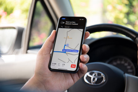 Alanya, Turkey - October 5, 2020: Man hand holding Apple iPhone 11 with Apple Navigation Maps on the screen. Apple iPhone 11was created and developed by the Apple inc.のeditorial素材