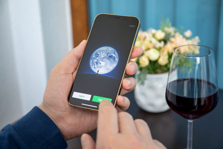 Alanya, Turkey - January 8, 2020: Man hand holding iPhone 12 Pro Max Gold with social networking service messenger WeChat on the screen.のeditorial素材