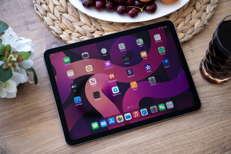 Alanya, Turkey - June 2, 2021: iPad Air IOS 14 with widget on the home screen. iPad was created and...