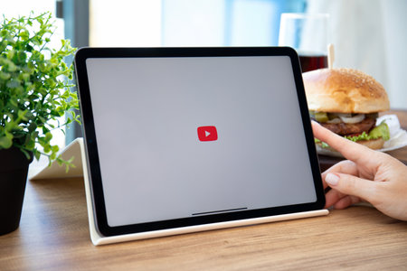 Alanya, Turkey - September 23, 2021: Apple iPad Air Space Gray with application video service YouTube on the screen. iPad was created and developed by the Apple inc.のeditorial素材