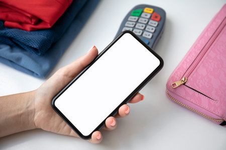 Woman payment purchase for phone with isolated screen and pay pass online terminal in the storeの写真素材