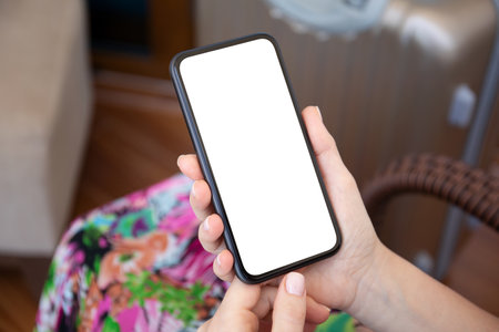 Woman hands hold phone with isolated screen background of colored dressの写真素材