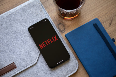 Alanya, Turkey - September 20, 2022: Apple iPhone 14 with multinational entertainment company Netflix provides streaming media and video on the screen.のeditorial素材