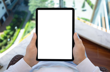 male hands hold computer tablet with isolated screen background office at the airportの写真素材