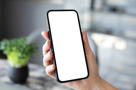 woman hand hold phone with isolated screen background of the officeの写真素材