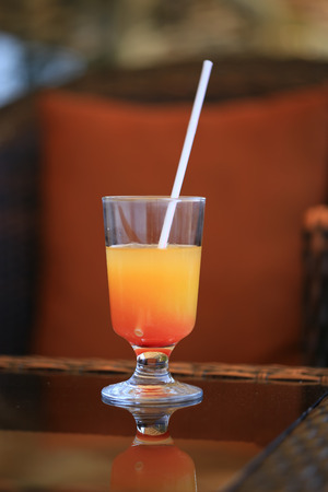 Orange cocktail on table in restaurantの写真素材