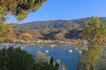 Beautiful view of the mountains and the port in Poros, Greeceの写真素材