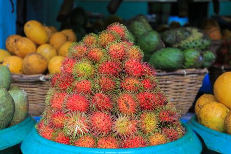Fresh rambutan fruit in the market close upの写真素材