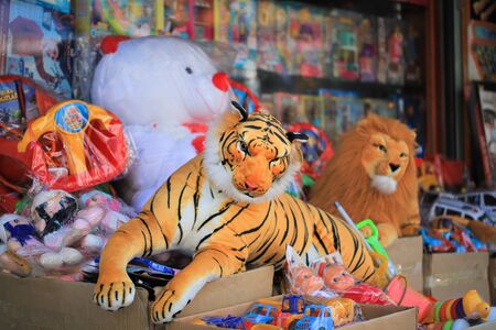 Funny plush tiger toy in the marketの写真素材