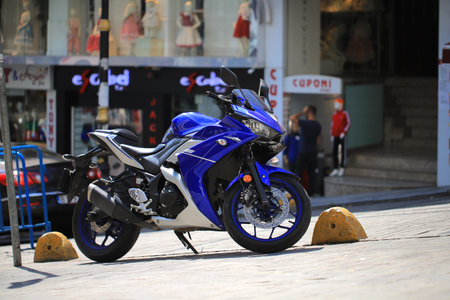 Blue sports motorcycle on a city street