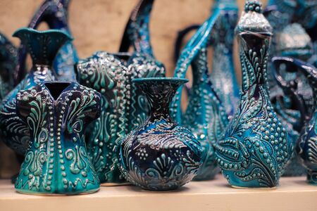 Turkish ornamental ceramic on a shelf in a storeの写真素材