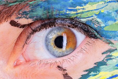 Caucasian female eye with body artの写真素材
