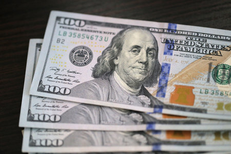 Money, US hundred dollar bills on the table