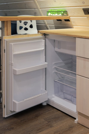 Small refrigerator in the kitchen at homeの写真素材
