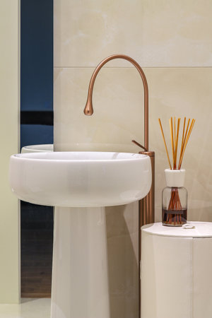 Modern white bathroom sink with faucet close-upの写真素材