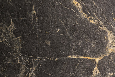 Light beige with black marble texture background close-upの写真素材