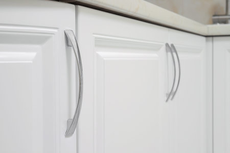 Kitchen furniture chrome door handle close-upの写真素材