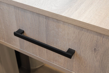 Furniture drawer door handle black color close-upの写真素材