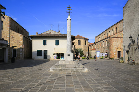 Grado, Italy - 20 July, 2019: Croce del Patriarcato Gradese in old town square in Grado cityのeditorial素材