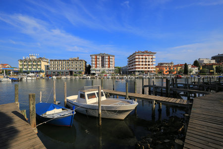 Grado, Italy - 20 July, 2019: Boats moored near the shore in Grado cityのeditorial素材