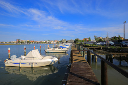 Grado, Italy - 20 July, 2019: Boats moored near the shore in Grado cityのeditorial素材