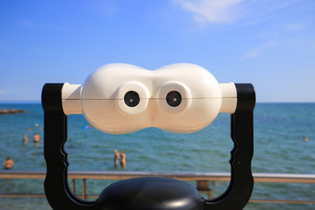 Telescope of tourist binoculars on the observation deck overlooking the sea in Grado cityの写真素材