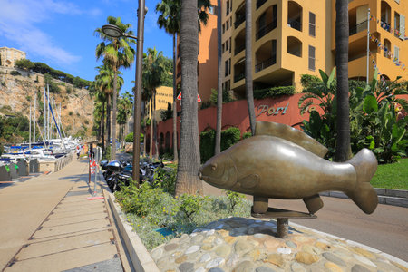 Monaco - 23 July, 2019: Bronze monument fish in the Port de Fontvieille in Monacoのeditorial素材