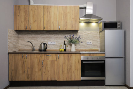 Facade of kitchen furniture in the kitchen interior
