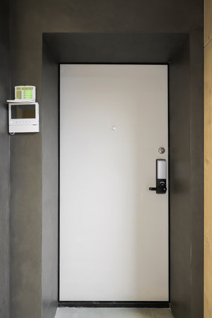 Entrance door inside an apartment building in a modern interiorの写真素材