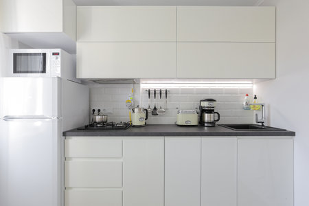 Facade of white kitchen furniture in the kitchen interiorの写真素材