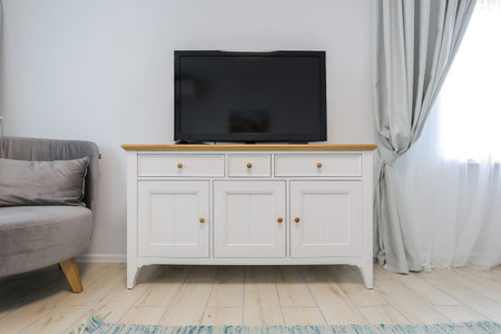 Modern TV on TV stand in the living room interiorの写真素材