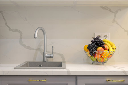 Faucet with granite sink in the kitchen interiorの写真素材